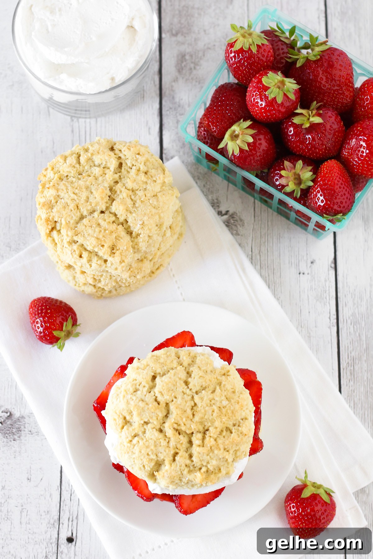 Gluten Free Vegan Classic Strawberry Shortcake. Soft, sweet biscuits, filled with fresh strawberries and whipped coconut cream. A classic summertime dessert!